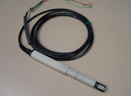 Vaisala HMP45C temperature sensor shown. Curled up wire attached to a tube like probe that is around 6 inches long.